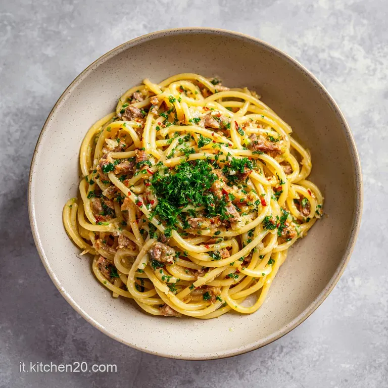 A vibrant swirl of green pasta topped with flaky sardines, toasted nuts, and a sprinkle of herbs.
